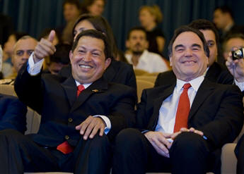 Venezuela's Hugo Chavez sits with filmmaker Oliver Stone, his adoring fan, at the Venice Film Festival last September. AP